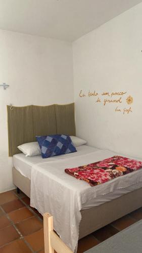 Una cama o camas en una habitación de Casa Dê - Hostel
