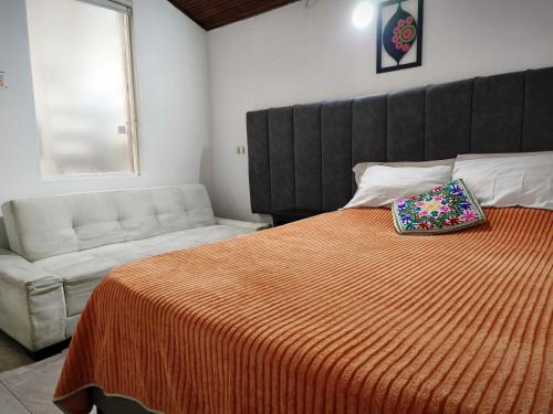 Postel nebo postele na pokoji v ubytování Ayllu Hostel