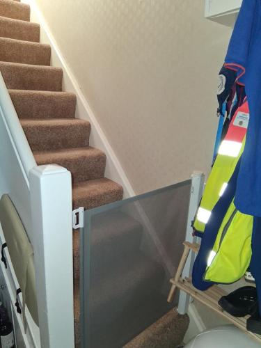 a stairway with a glass railing next to a staircase at Levens Terrace, Barrow Spa Therapy in Barrow in Furness