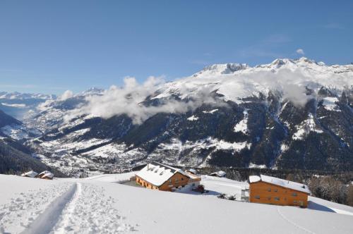 a ski lodge on top of a snow covered mountain at Berghotel Chäserstatt in Ernen