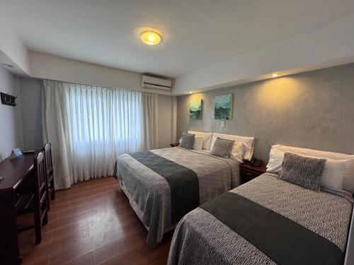 Postel nebo postele na pokoji v ubytování Hotel Termal Emperatriz Termas de Río Hondo