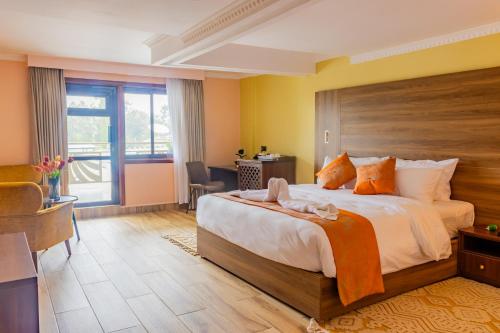 Postel nebo postele na pokoji v ubytování Karen Plains Hotel Nairobi