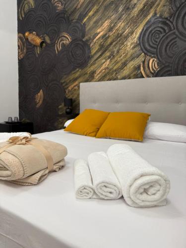 Giường trong phòng chung tại Antica Sicilia Rooms and Breakfast