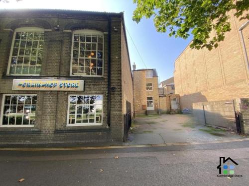 a brick building with a sign on the side of it at 1 Bedroom Apartment Central located near Park in Cambridge