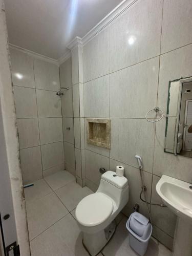 a bathroom with a toilet and a sink at PRINCESA HOTEL Russas in Russas