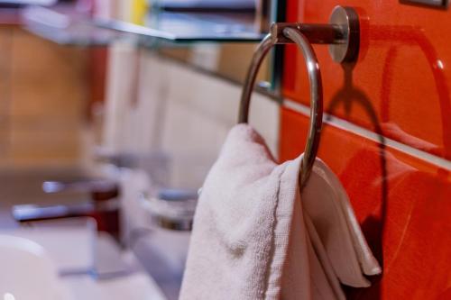 a towel is hanging on a towel rack at Karen Plains Hotel Nairobi in Nairobi