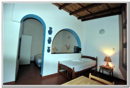 Voodi või voodid majutusasutuse Hotel La Posada del Sol toas