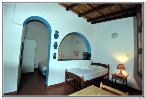 Katil atau katil-katil dalam bilik di Hotel La Posada del Sol