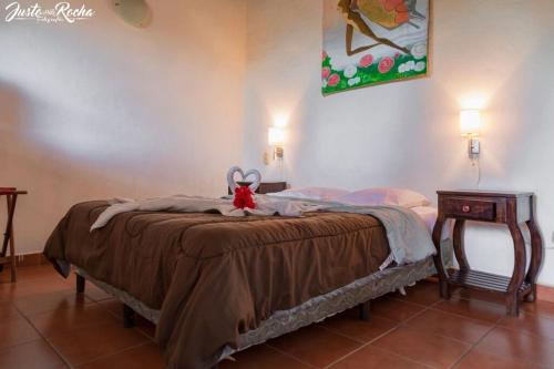 Ένα ή περισσότερα κρεβάτια σε δωμάτιο στο Hotel La Posada del Sol