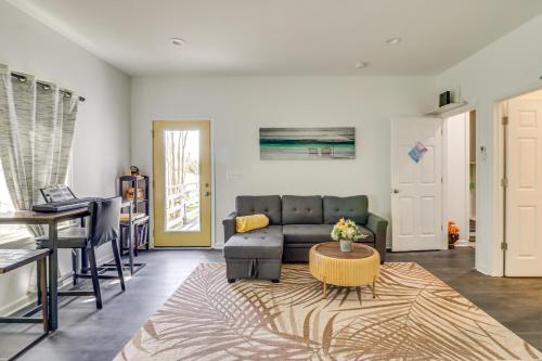 a living room with a couch and a table at Potomac River Getaway Walk to Marina! in King George