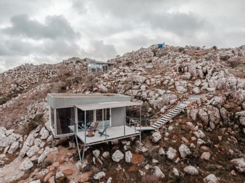 a house on top of a rocky mountain at Eco-Suite Estación Penitente in Minas