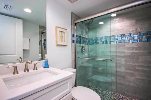 a bathroom with a shower and a sink and a toilet at Spacious 2BR Condo With Beach Views Sanibel Island 1C2 in Sanibel
