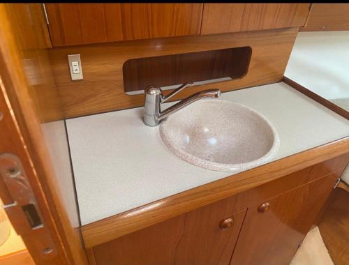 a bathroom sink with a faucet on top of it at eMeM in Calheta