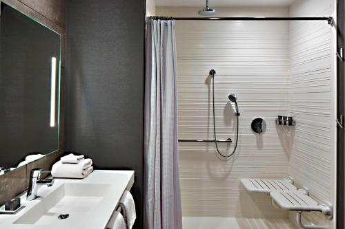 a bathroom with a shower and a sink at AC Hotel Columbus Dublin in Dublin