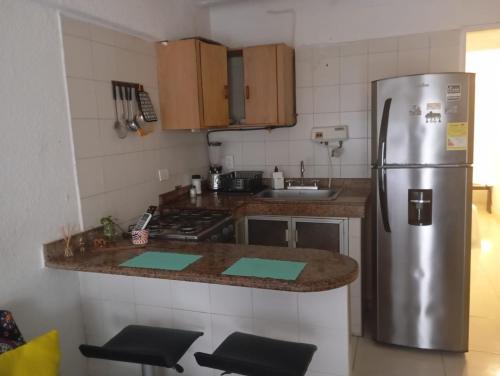 Η κουζίνα ή μικρή κουζίνα στο @casa__grace Apartaestudio en edificio al frente del mar!!