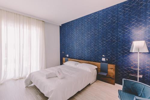 Postel nebo postele na pokoji v ubytování Suite 10 Home Design & Spa