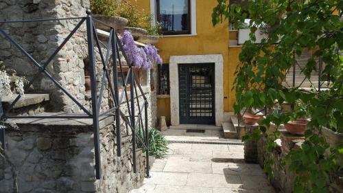 a house with a door with a purple teddy bear at Il Nido del Falco in Castel Gandolfo
