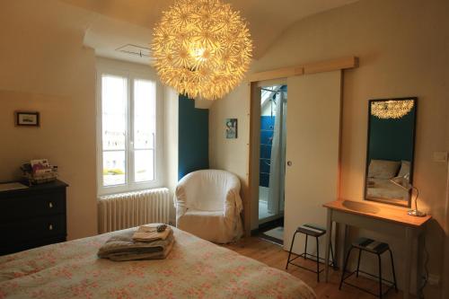 Ένα ή περισσότερα κρεβάτια σε δωμάτιο στο Chambre d'Hôte à Douarnenez