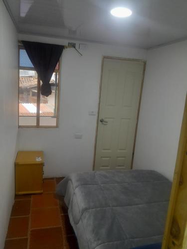 Ein Bett oder Betten in einem Zimmer der Unterkunft Hotel Mahoma