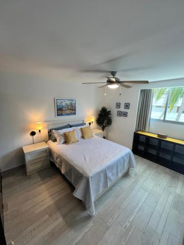 a bedroom with a bed and a ceiling fan at TERRA 1B CONDO - Nuevo Nayarit in Nuevo Vallarta