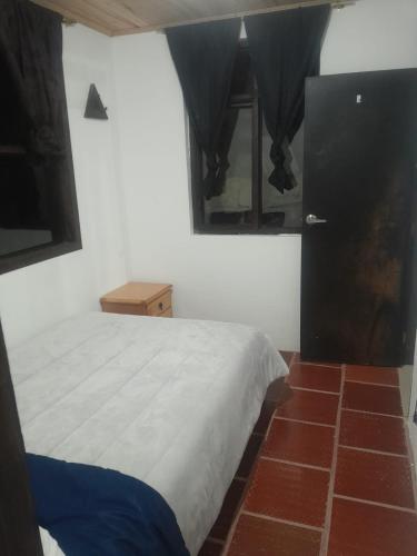 Ein Bett oder Betten in einem Zimmer der Unterkunft Hotel Mahoma