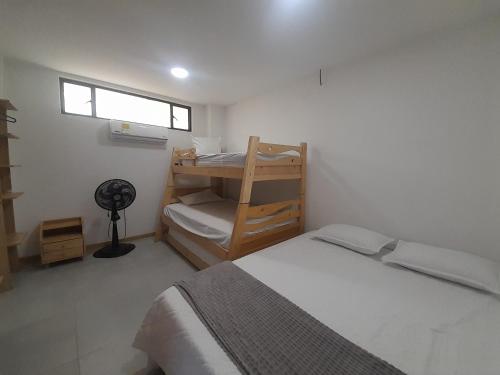 Ένα ή περισσότερα κρεβάτια σε δωμάτιο στο CASA HOTEL SANTA INES