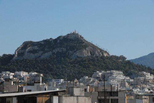 a view of a mountain with a city at Vienna Hotel in Athens