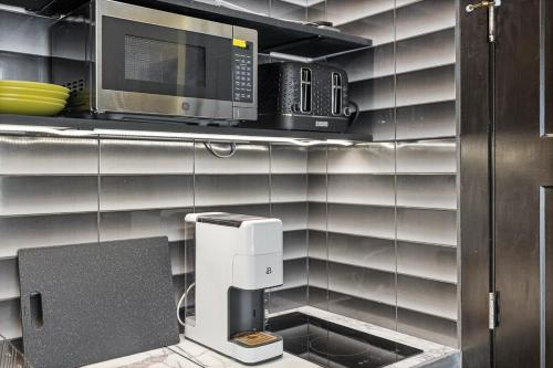 a kitchen with a microwave and a coffee machine at Reflection Ridge in Lead