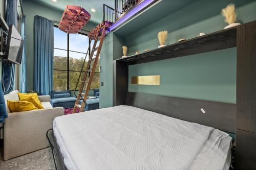 a bedroom with a large bed and a ladder at Reflection Ridge in Lead