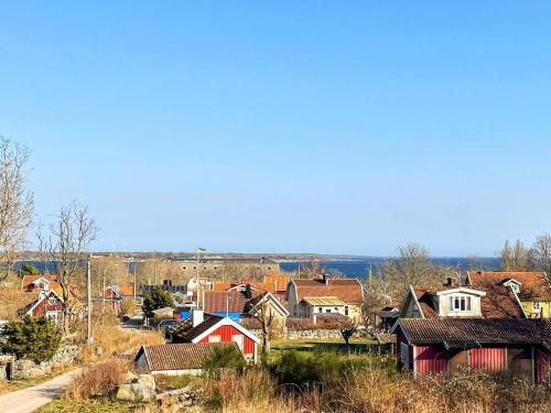 a small village with houses and a road at 4 star holiday home in Drottningskär in Drottningskär