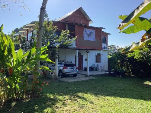 a car parked in front of a house at Vientos de magia in La Esperanza