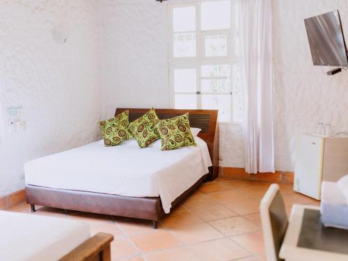 Ein Bett oder Betten in einem Zimmer der Unterkunft Hotel Kalma