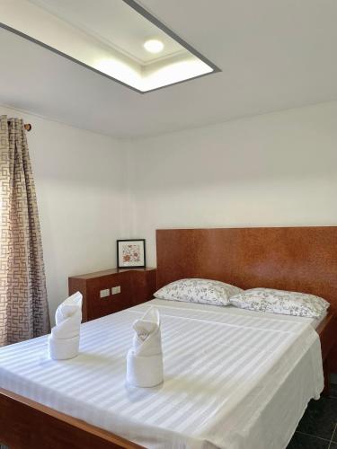 Postel nebo postele na pokoji v ubytování Beachfront Hostel