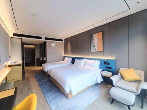 Postel nebo postele na pokoji v ubytování Hilton Garden Inn Xiamen Tong'An