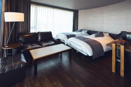 Postel nebo postele na pokoji v ubytování Business Resort Kyuan