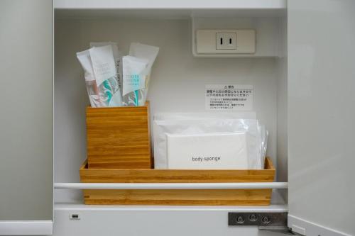 a closet with two boxes of toothbrushes at 心邸 kukuru in Nakijin