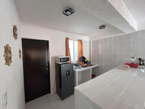 Kuchyň nebo kuchyňský kout v ubytování Secretos del Sol Acapulco villas a 5 minutosdel mar