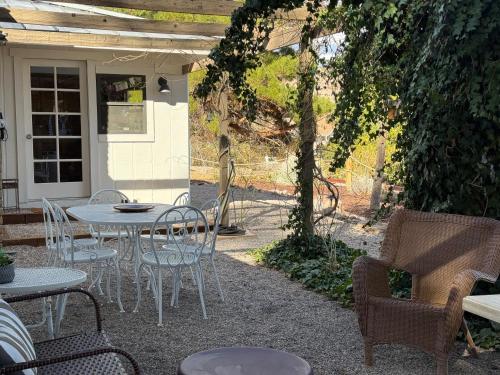 a patio with chairs and a table and chairs at Sunshine House - Nestled In Page Springs in Cottonwood