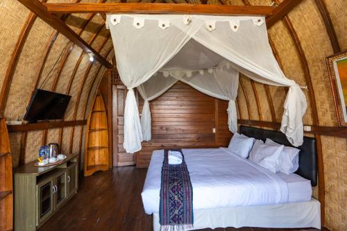 Postel nebo postele na pokoji v ubytování Tiing Bali
