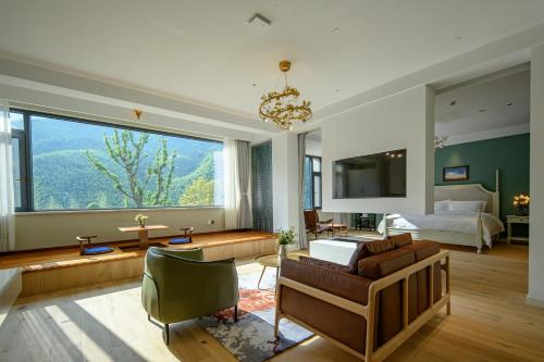 Moganshan Xinyuanju Homestayにあるベッド