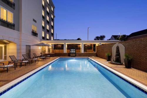 a large swimming pool in front of a building at Courtyard by Marriott Charleston Historic District in Charleston