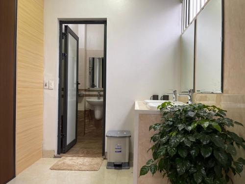 a bathroom with a sink and a mirror at Home 33 in Sa Pa