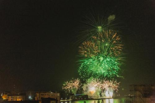 a firework display in the sky at night at 西里海岸 電梯民宿 in Magong