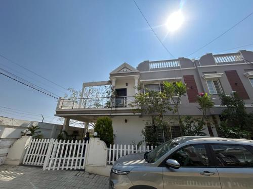 a house with a car parked in front of it at MYSA Luxurious Homestay near Airport Bhopal in Bhopal