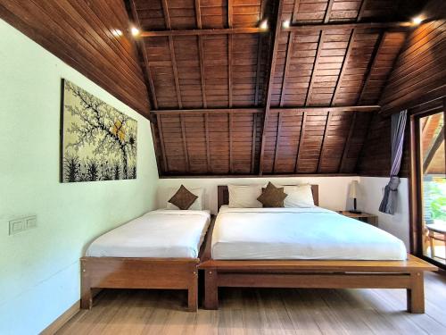 Katil atau katil-katil dalam bilik di Tahoma Villas Labuan Bajo by ABM