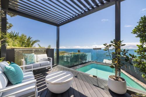 a house with a view of the ocean at Cliff Top Escape in Curl Curl