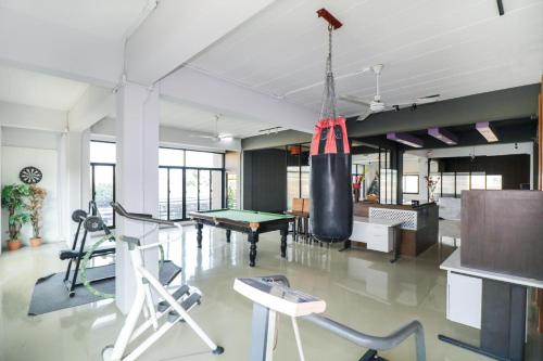 a gym with a punching bag hanging from the ceiling at King One Suvarnabhumi in Bangkok