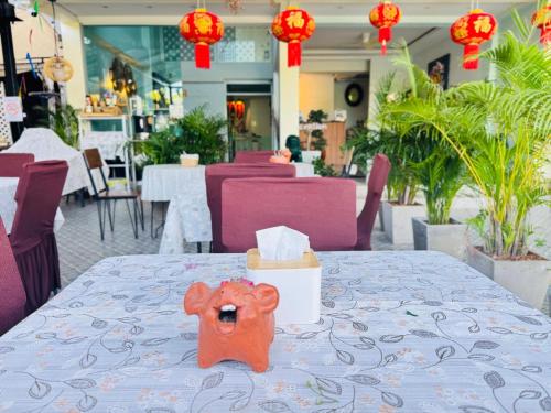 a table with a teddy bear on top of it at Collection O Room Lanna Hotel in Chiang Mai