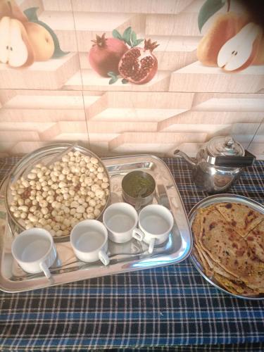 a tray of food on top of a table at Parvatiya Homestay in Mussoorie