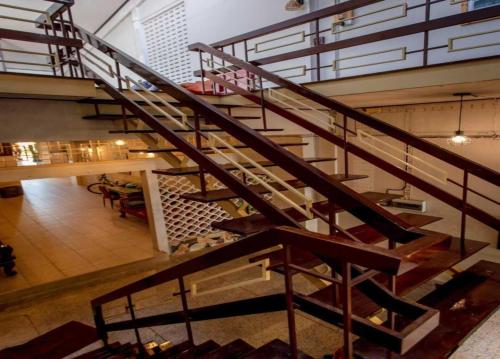 an overhead view of a staircase in a building at OYO 75469 Baan Kong Hostel in Ban Talat Takua Pa